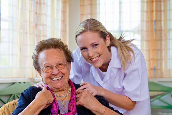 Caregiver with woman in her home