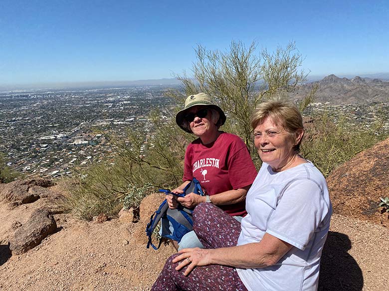 Sue Henderson with new friend hiking in AZ